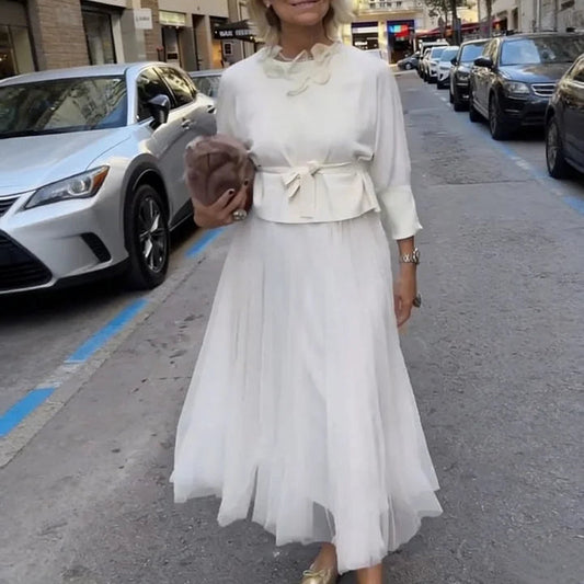 An elegant midi dress for women, featuring a multi-layered mesh design.