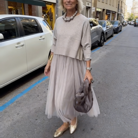 An elegant midi dress for women, featuring a multi-layered mesh design.