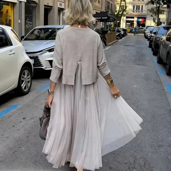 An elegant midi dress for women, featuring a multi-layered mesh design.