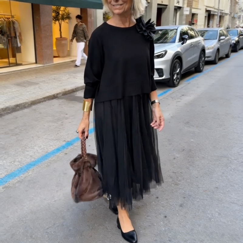 An elegant midi dress for women, featuring a multi-layered mesh design.